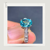 Vivid Blue Tourmaline and Diamond Halo Ring